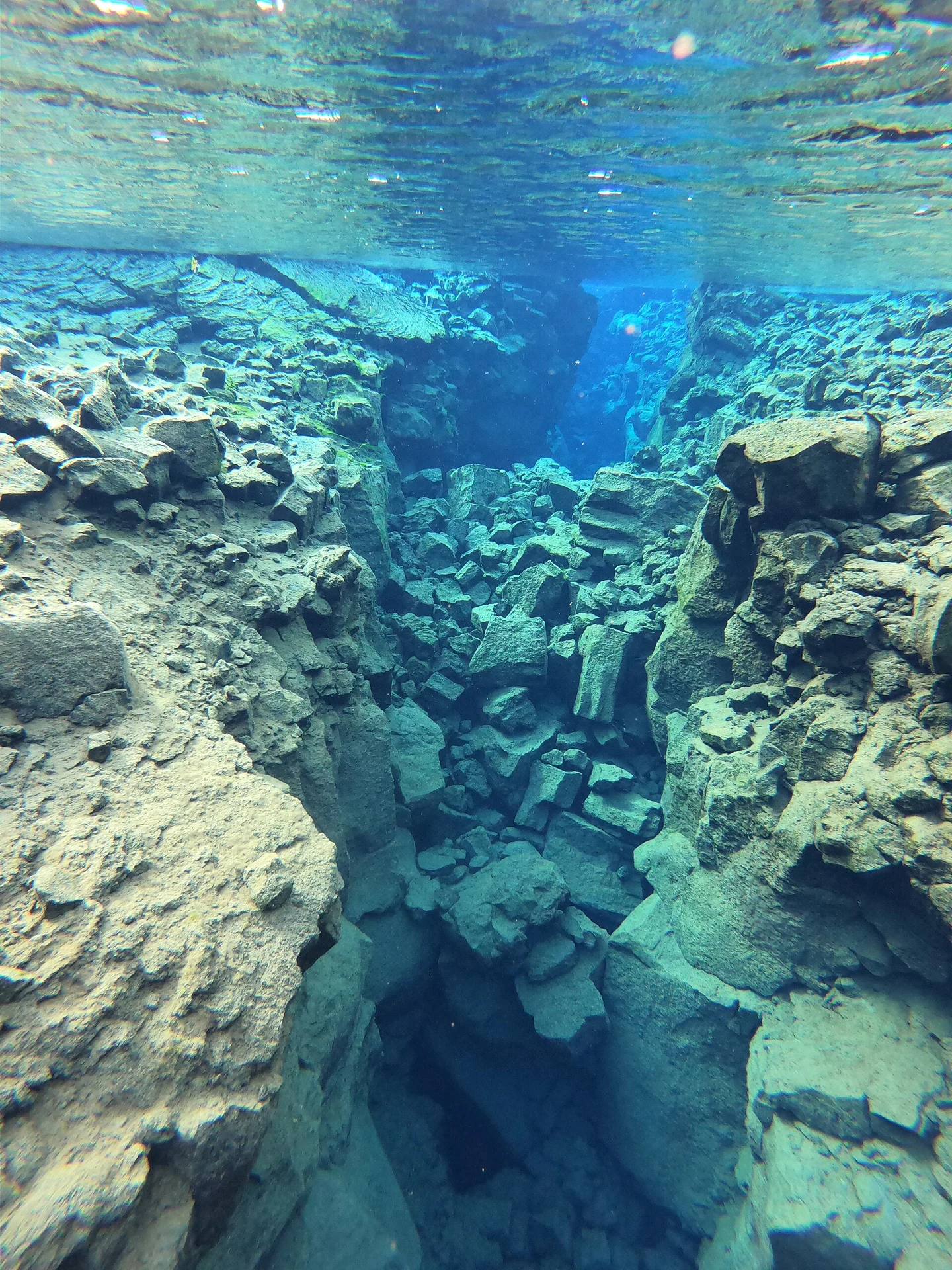Clear water and submerged rock walls in the Silfra fissure
