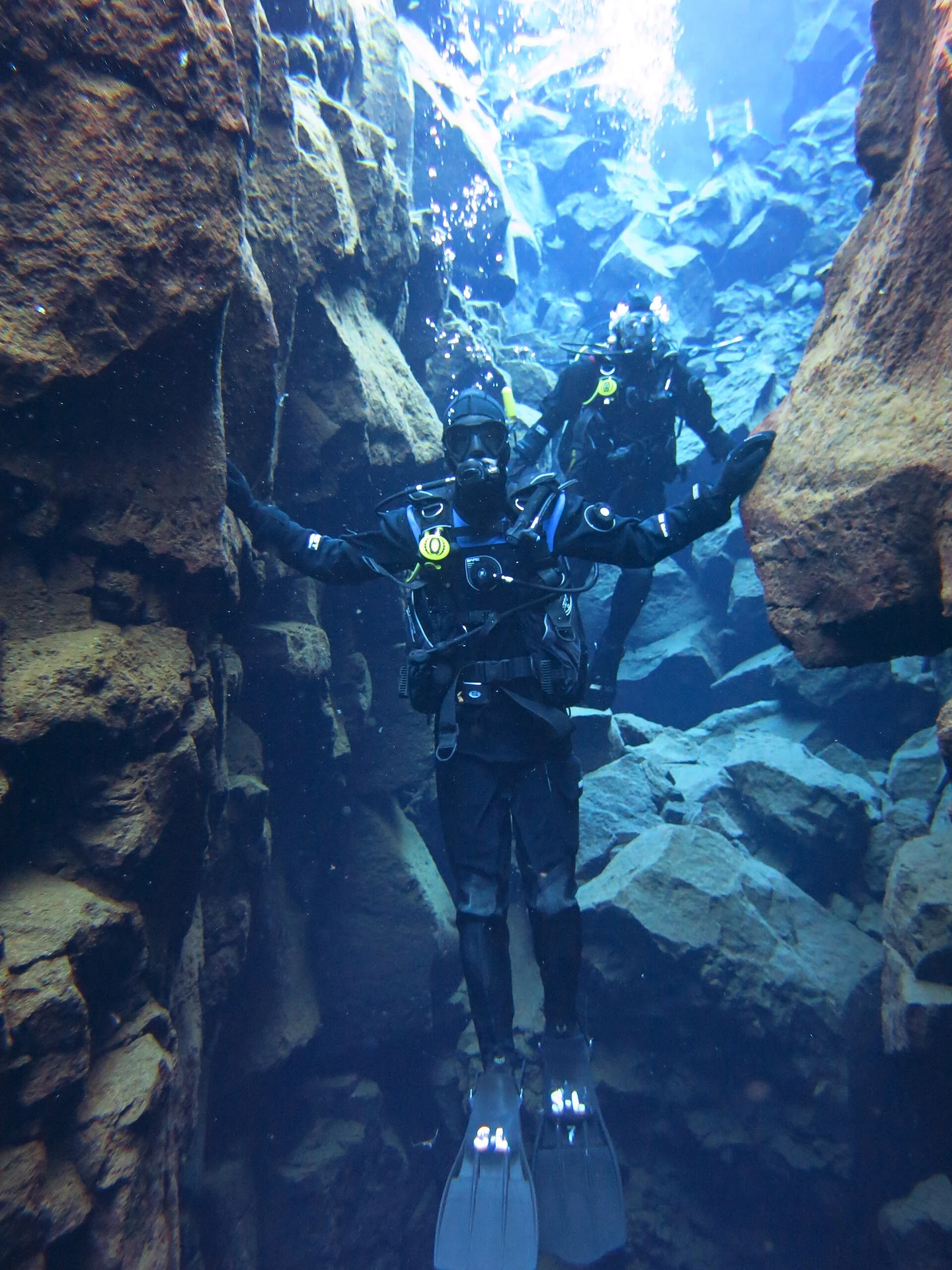 Divers beneath the surface in the Silfra fissure