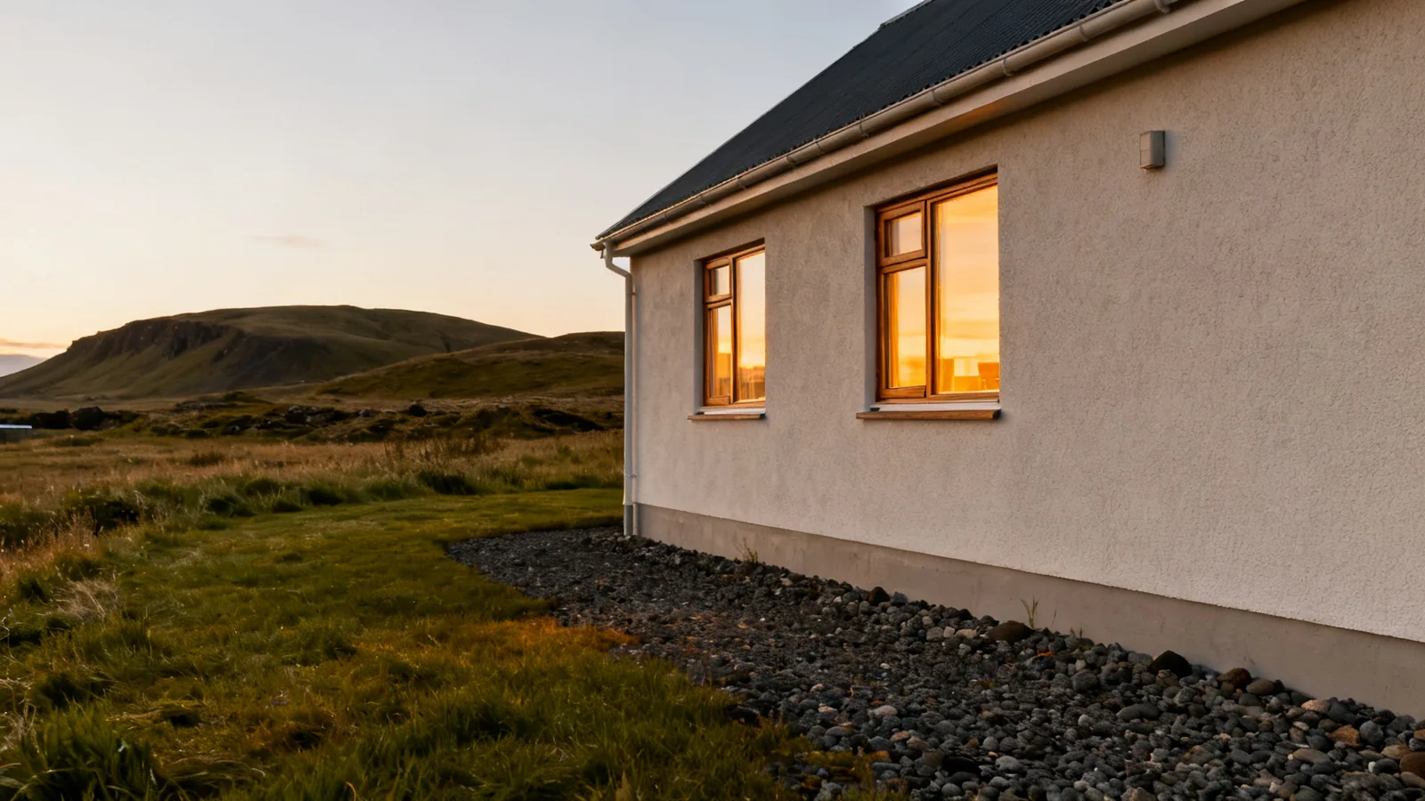 Generic rural Icelandic guesthouse with lit windows